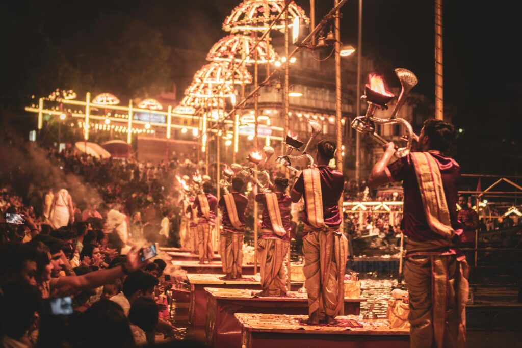 A captivating night scene of the Ganga Aarti ceremony on the riverbank in Varanasi, India.