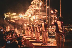 A captivating night scene of the Ganga Aarti ceremony on the riverbank in Varanasi, India.